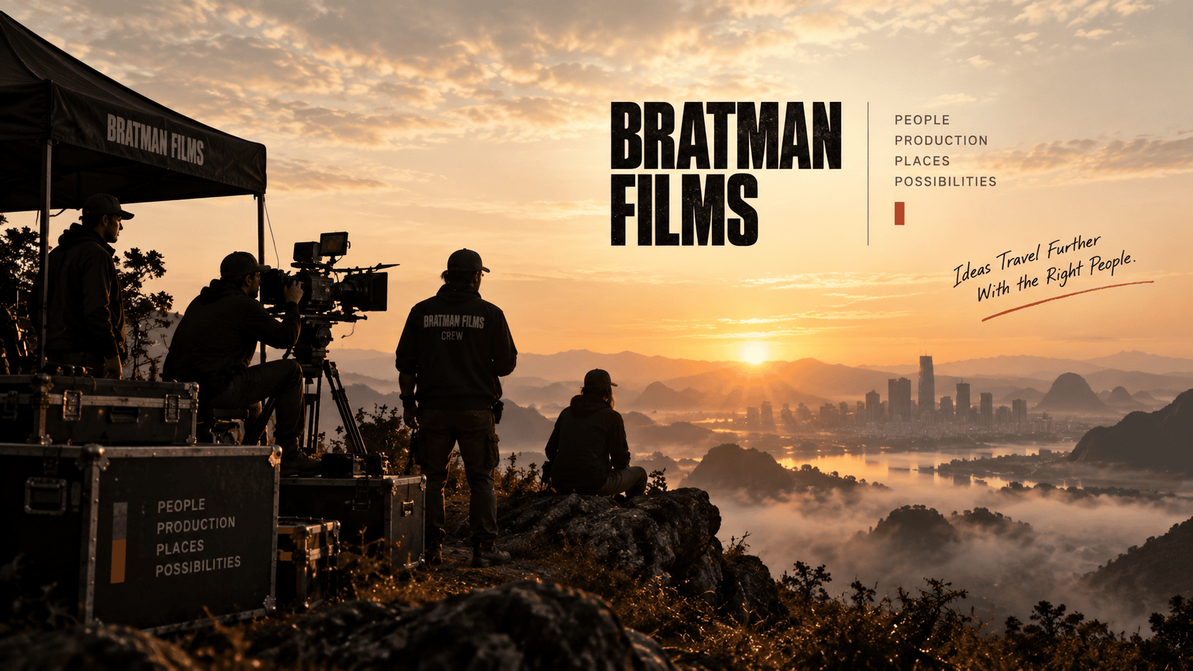 A film crew shooting at sunrise on a mountaintop